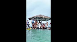 Tourists panic when floating cabana capsizes