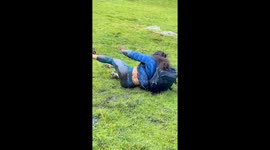 Hilarious backpack slippery slope causes hiker to fall