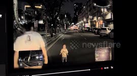 Toddler wanders into traffic at night - passing driver steps in to rescue him