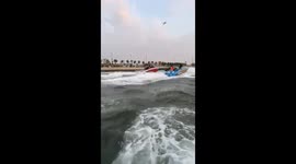 Thrilling jet-ski ride ends in a splash after unexpected collision with a wave