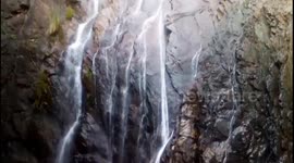 A beautiful and tranquil waterfall nestled in the tree-covered forest of padhanpat Hills in Deogarh, Odisha, India.