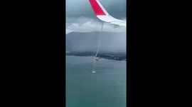 Plane passengers see stunning waterspout tornado stretching from the clouds