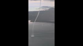 Stunning waterspout tornado seen stretching from the clouds to sea below