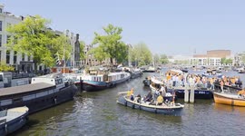 Boats on Amstel river during the Kings day celebrations on 26 April 2025