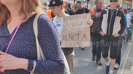 Just Stop Oil for One Last Action by marching around Parliament Square in London, England