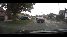 Red light driver passes Bedfordshire Police to get to the red light. Dunstable UK 26.04.25