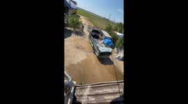 Women enjoy splashing in water-filled truck in Santo Domingo