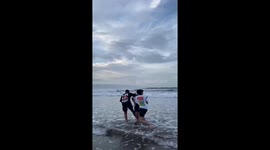 Boys prank friend by pushing him into ocean in Sukabumi City
