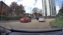 25s dashcam clip of a near miss. A BMW X5 uses the wrong lane and almost crashes into another BMW.