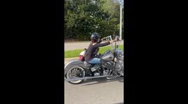 Pet Monkey Rides on Back of Motorcycle