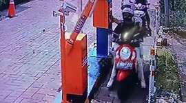 Car park barrier fail whacks motorcycle rider in the face