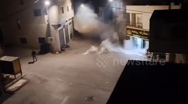 Israeli forces fire tear gas at Palestinian youth during West Bank raid