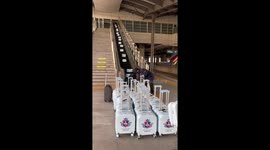 Dozens of matching suitcases sent down escalator in China