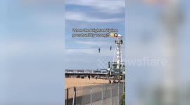 Two teens get stuck on zipline - and have to be pulled along with a pole