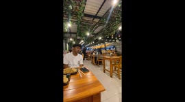 Waiter spills drink while serving at Mie Gacoan in Cirebon