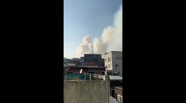 Helicopters battle wildfire sending smoke of South Korea