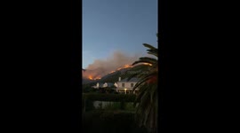 Wildfire rages on hillside over homes in Cape Town