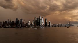 US: Thunderstorm over New York City at sunset