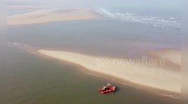 RNLI rescues two stranded walkers in Wells