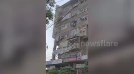 India: Fire erupts in multi-storey commercial building, people seen dangling from windows as flames rage on