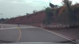 Cyclist loses control and plunges down hillside