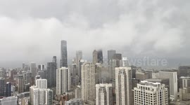 Fog crawls through Chicago skyscrapers