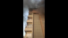 Hero locals catch girl jumping from burning building in India