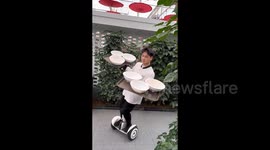 Staff at Chinese restaurant deliver dishes on hoverboards