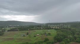 Strong moving Supercell with rain wrapped rotation and lightning Mountainburg, AR