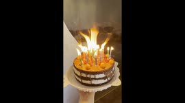 Man Tries Everything To Blow Out Birthday Candles