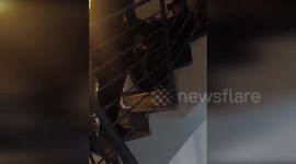 Spain: National Police Officers Carry Man In Wheelchair To Third Floor Apartment