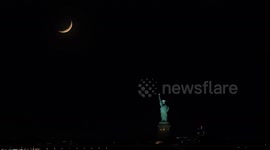 US: Stunning crescent moon sets behind Statue of Liberty in New York City