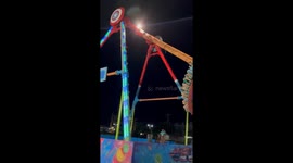 Swinging fairground ride falls apart as terrified park staff run for cover