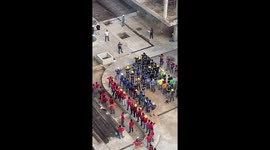 Builders do group stretching sessions before day on construction site