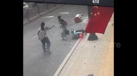 Girl cheats death by stopping bike to rub eyes, narrowly avoids falling water heater in freak windstorm in China