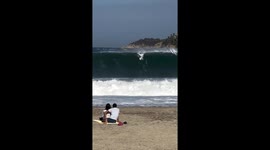 People watch surfer at Playa Zicatela, Oaxaca, Mexico