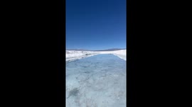 Woman falls into water while trying to jump across pool in Salinas Grandes