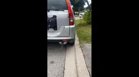 Bizarre noises emerge from car exhaust after bike inner tube is attached to it