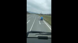 Tiny Vehicle Drives Along Czech Roadway