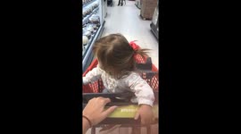 Cart with baby hits aisle during playful moment in Lima