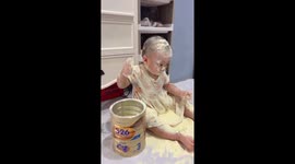 Child plays with spilled baby formula in Manado