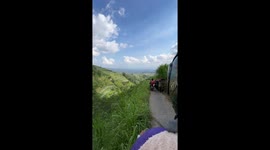 Tourist crashes into riders blocking path and tumbles down hillside