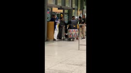 Family have beer and crisps waiting for cousin as she returns home