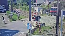 Lorry with raised platform rips down power lines and topples over