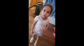 My daughter and I  were putting up decorations for my Granddaughter Brielle 's 3rd Mermaid Birthday party. When unknown to us she got a hold of the decorations. I had my phone in my hand when I looked up and saw something under my Granddaughter's shirt th