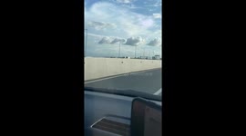 Cute cloud formation appears above road in Indonesia