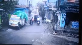 A stray bull ran off with a scooter parked on the side of the road in Rishikesh, Uttrakhand