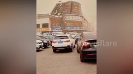 Billboard blown off a building during a violent storm in China