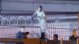 US, Los Angeles: Downtown Los Angeles Suspect Attempting To Flee Gets Stuck On Fence