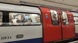 A train carrying countless commuters on a sweltering summer day in London, England